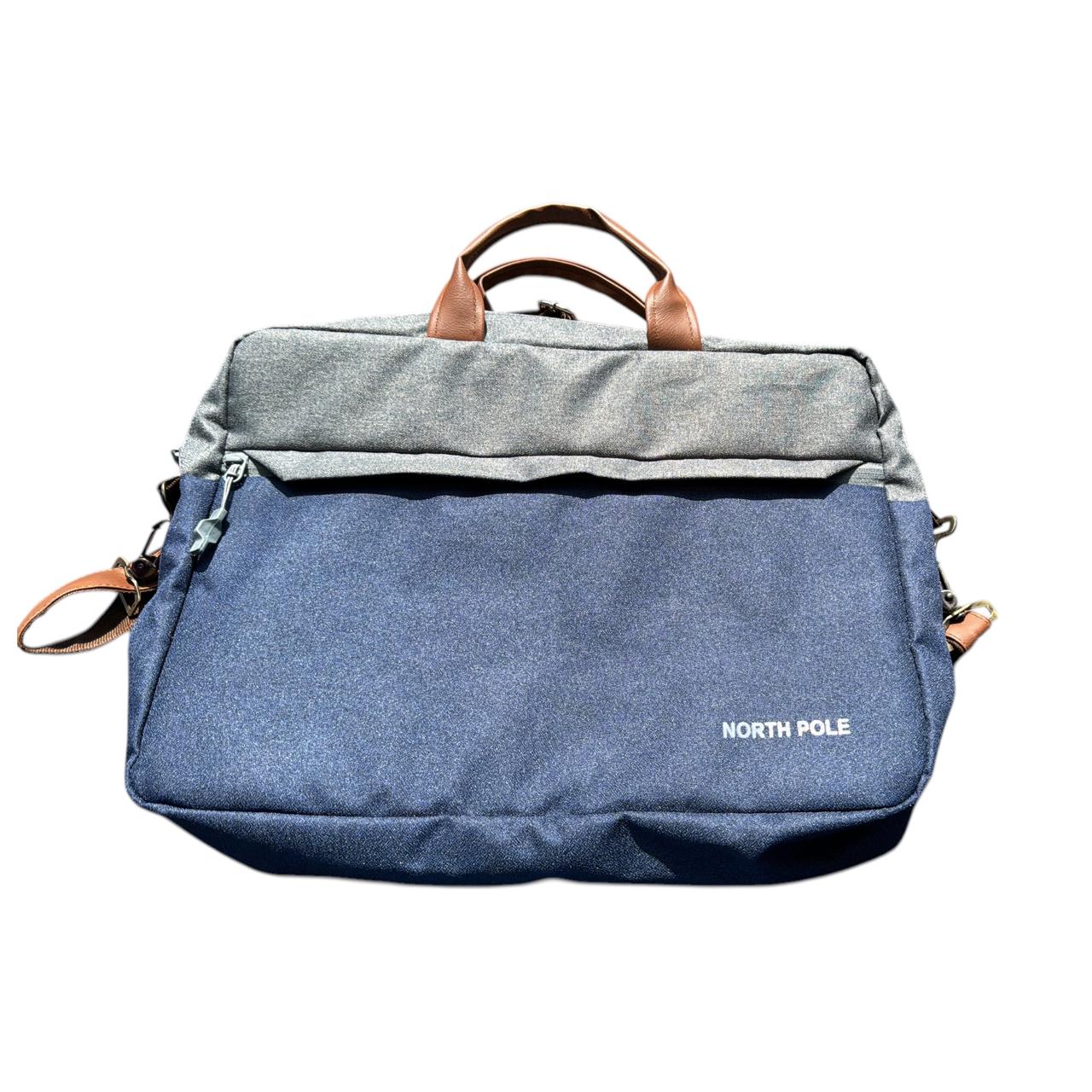 North Pole laptop messenger bag in a two-tone blue and grey canvas material with brown faux leather handles.