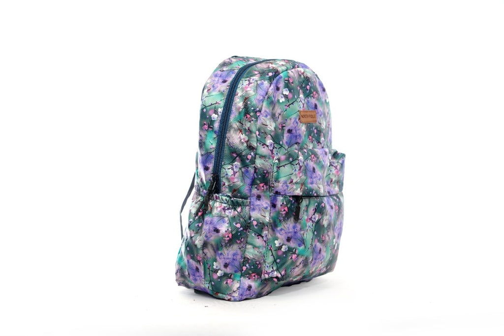North Pole| Backpack with a purple and green floral print.Casual backpack, School backpack, College backpack, Travel backpack, Laptop backpack, Colorful backpack