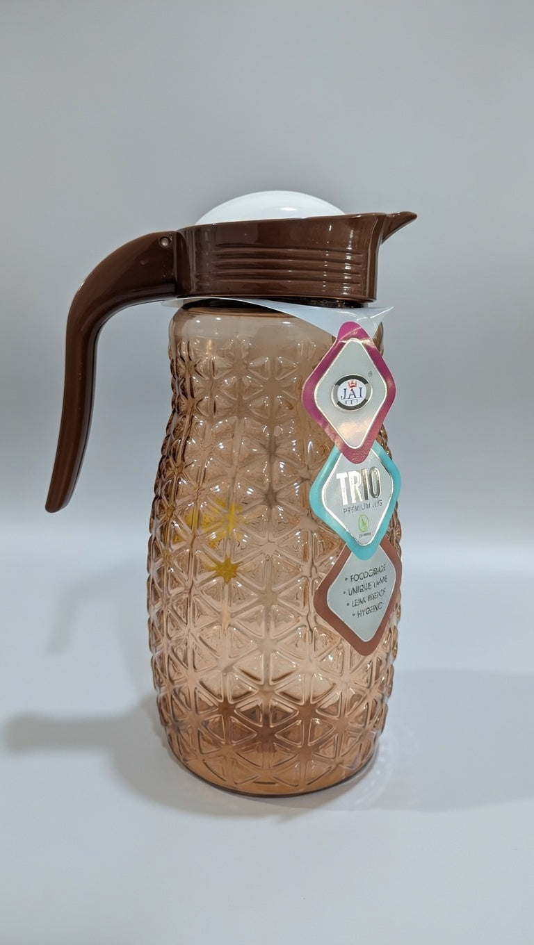 Pineapple textured glass jug with a brown plastic lid and handle.