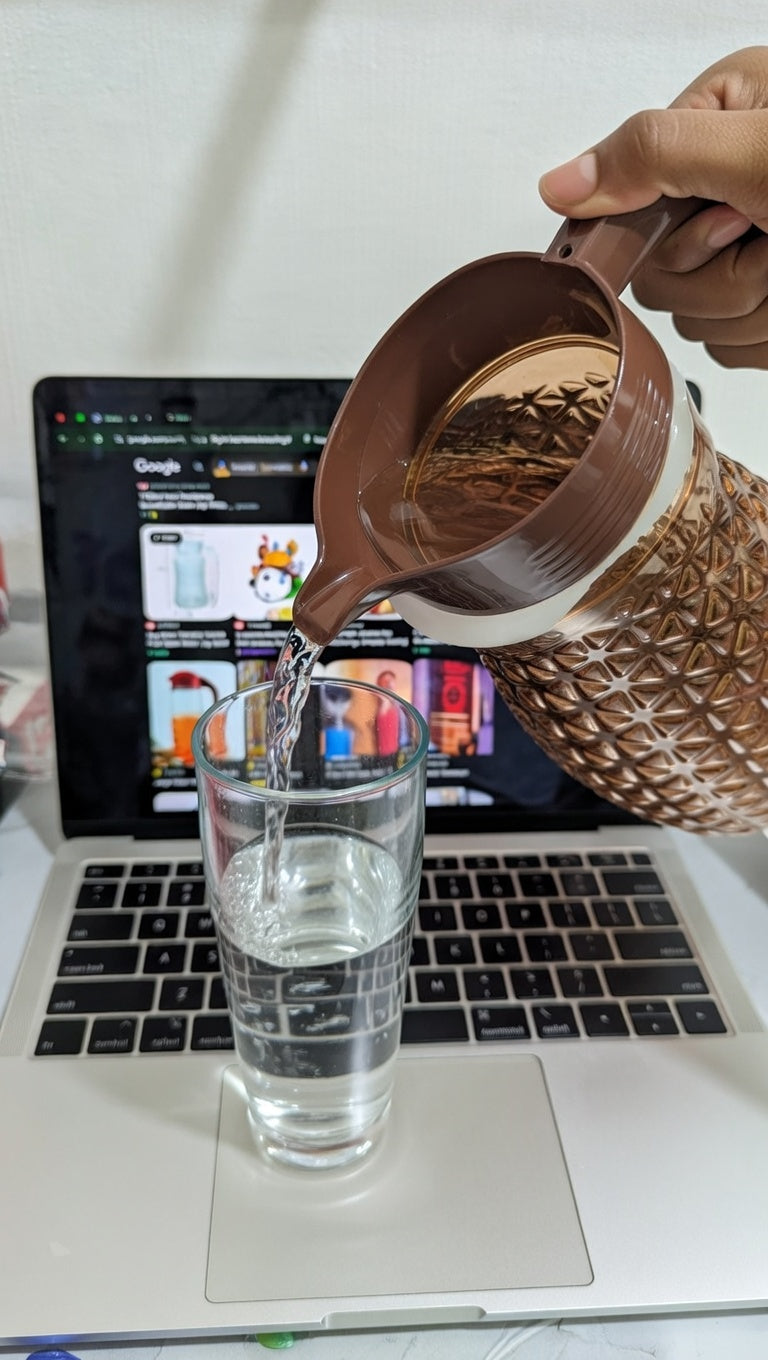 Pineapple textured glass jug with a brown plastic lid and handle.