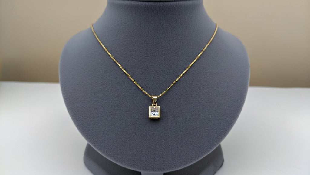 yellow gold geometric glistening lab-grown diamond pendant necklace.