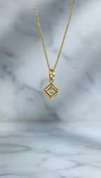yellow gold geometric glistening lab-grown diamond pendant necklace.