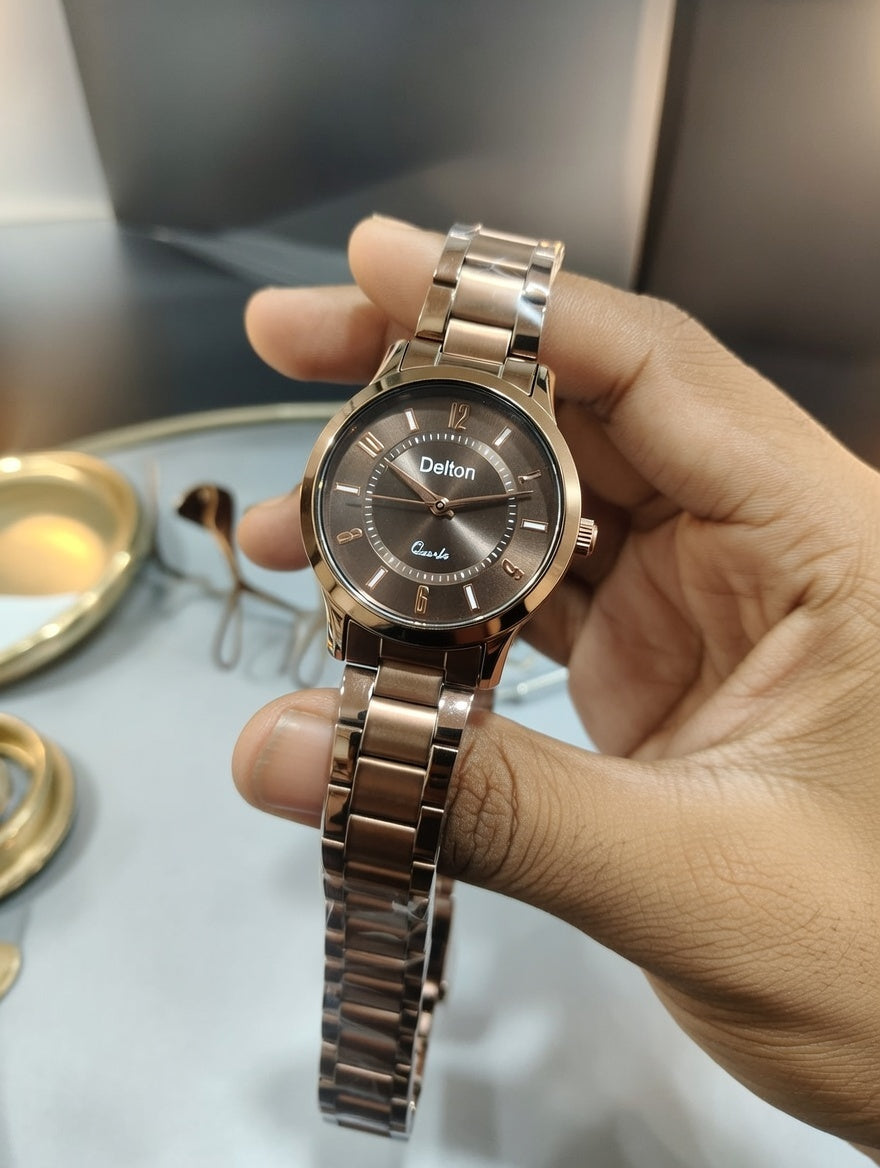 Rose gold dial women's watch with a stainless steel strap,