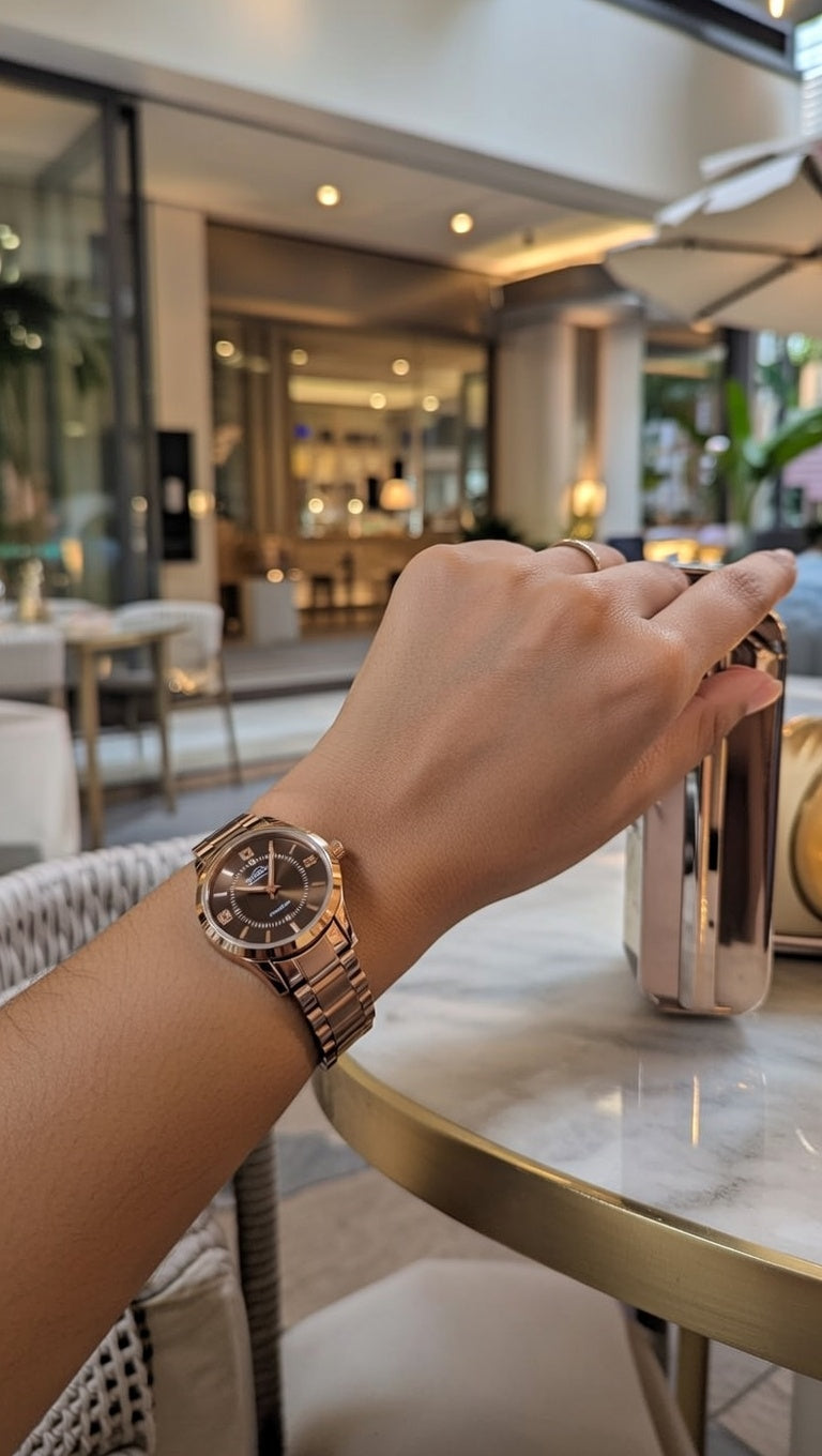 Rose gold dial women's watch with a stainless steel strap,