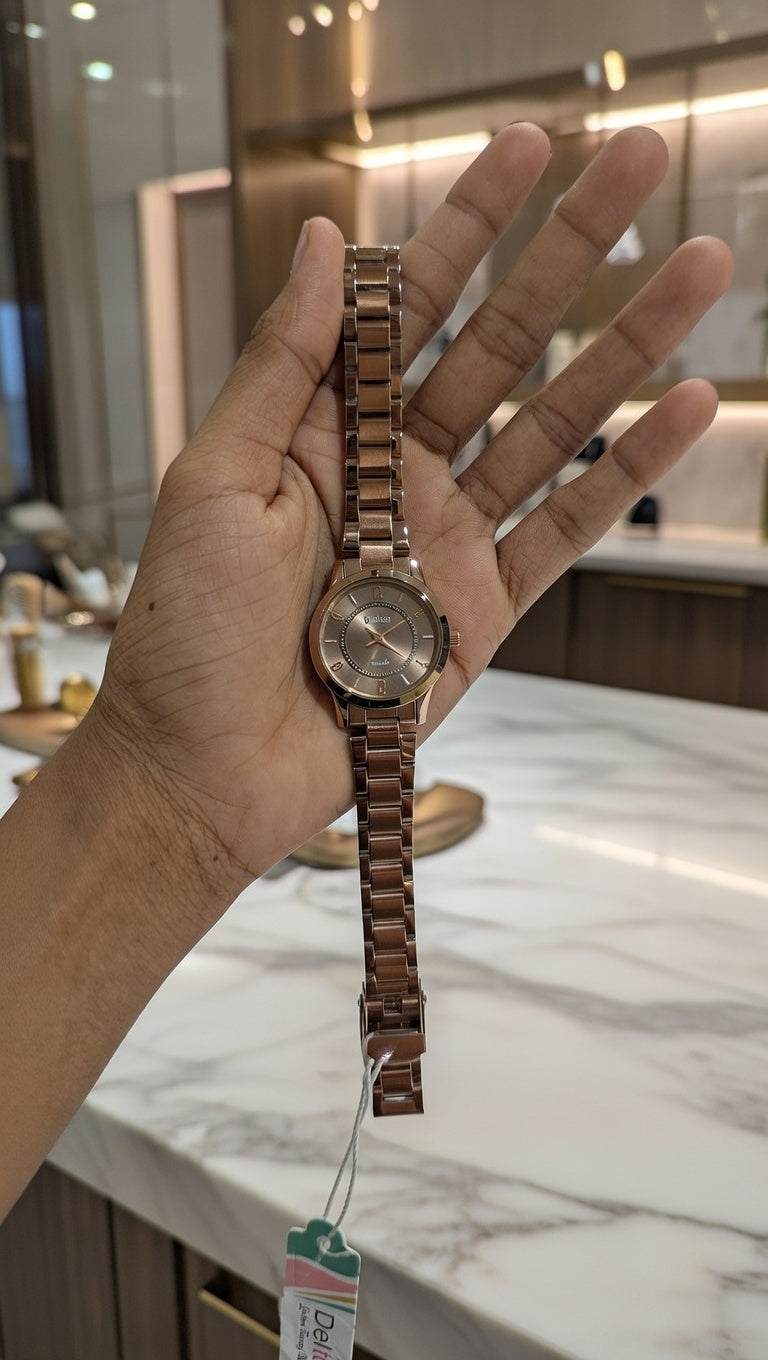 Rose gold dial women's watch with a stainless steel strap,